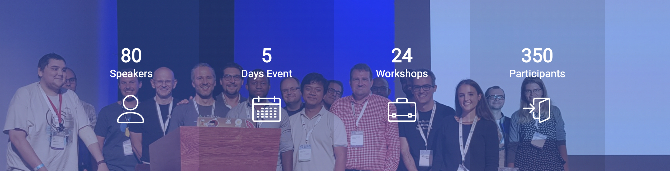 A group of people in the background are overlayed with short statistics about EuroSciPy 2022